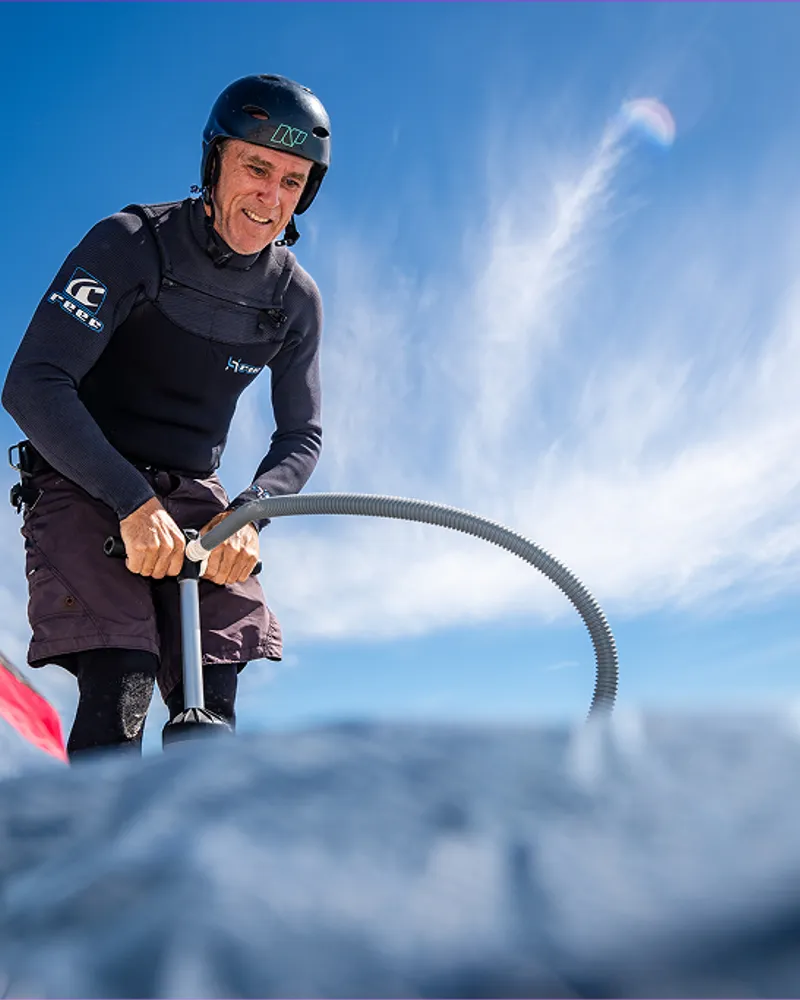 A rider pumping up his kite